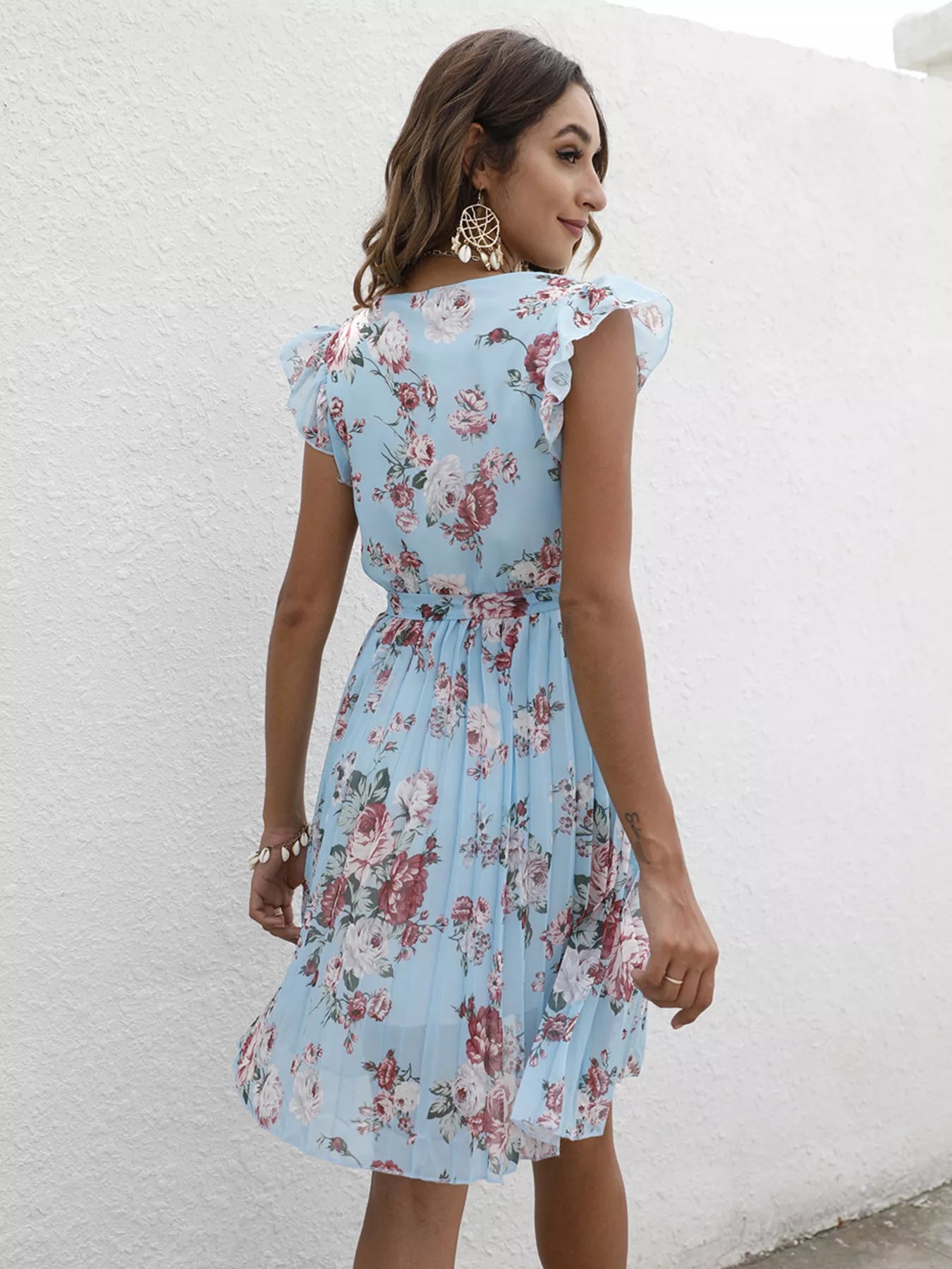 Light blue floral ruffle-sleeve dress from back, pleated skirt and tie waist