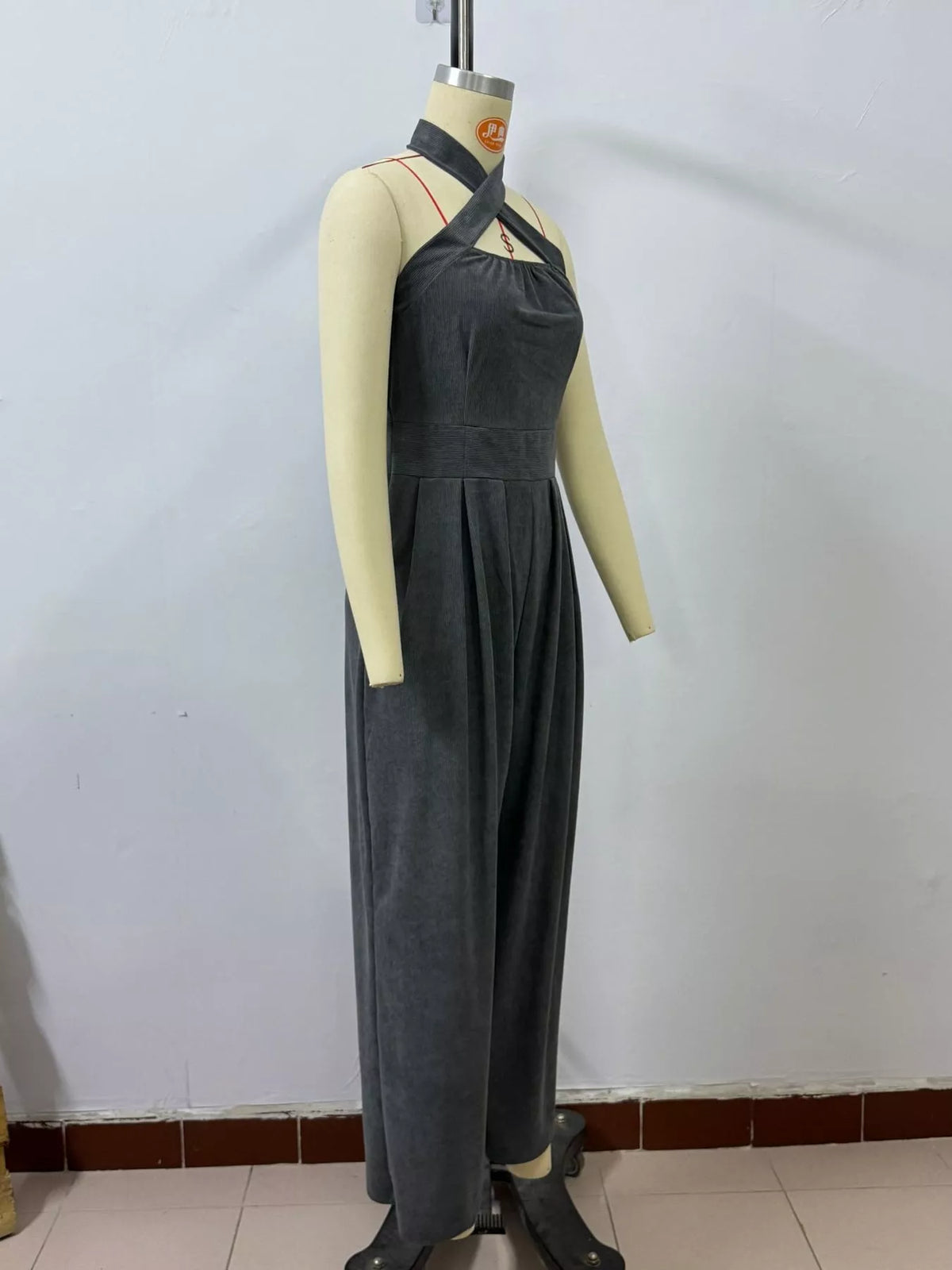 Black halter linen jumpsuit, high waist, wide-leg pants with keyhole neckline