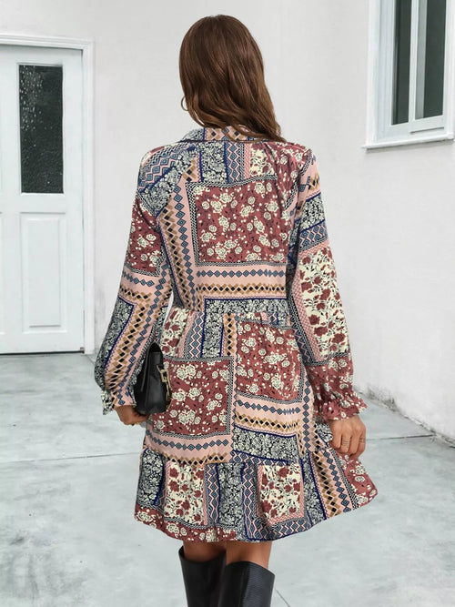 Floral patchwork long-sleeve mini dress, back view, maroon and blue pattern