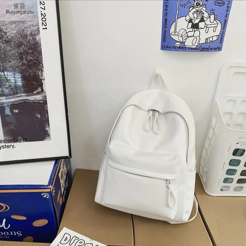 Ivory vegan leather zip backpack with drawstring top and front zipper pocket