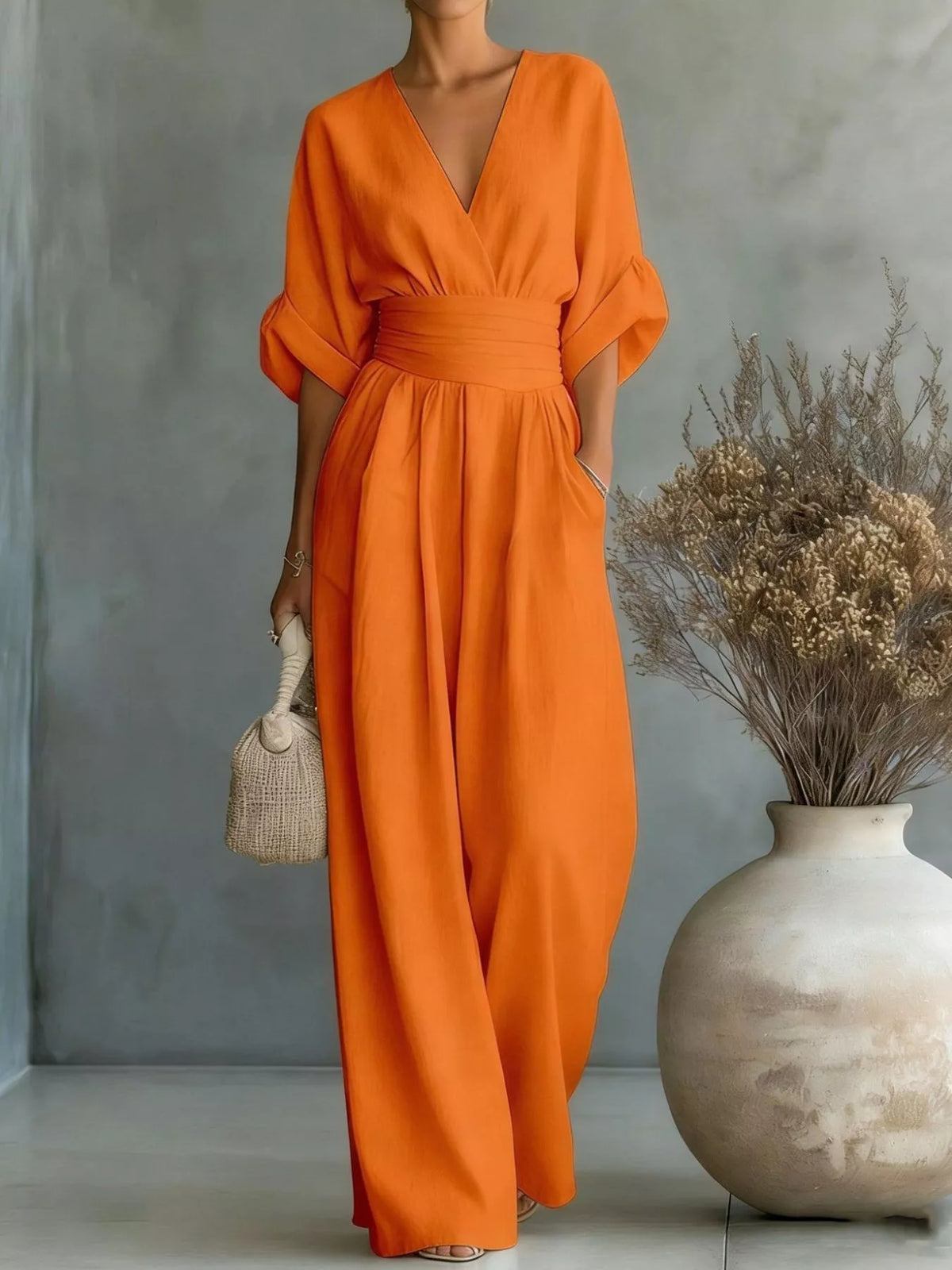 Orange ruched-waist wide-leg jumpsuit with V-neck and half sleeves