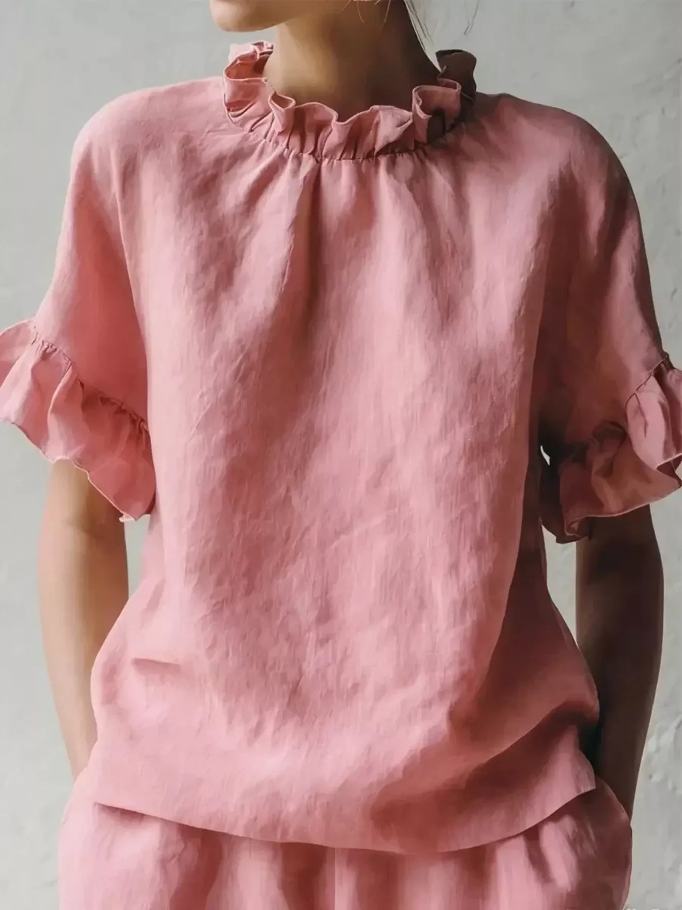 Pink ruffled neck half-sleeve blouse with gathered high neckline and flutter sleeves