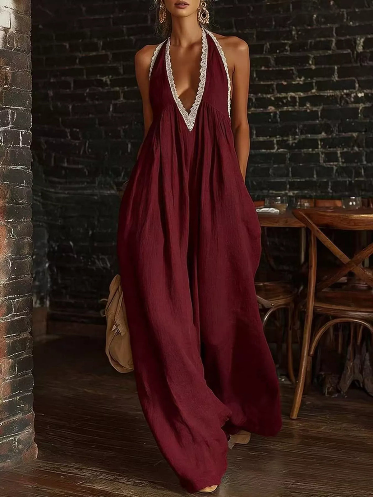 Burgundy sleeveless V-neck jumpsuit with lace trim and billowy wide-leg silhouette