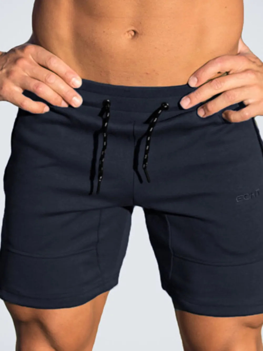 Navy drawstring shorts with front tie cords and side pockets