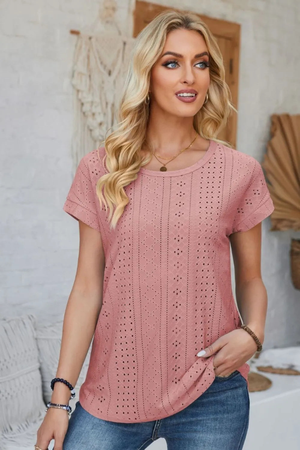 Blush pink eyelet round-neck short-sleeve t-shirt with rolled sleeves