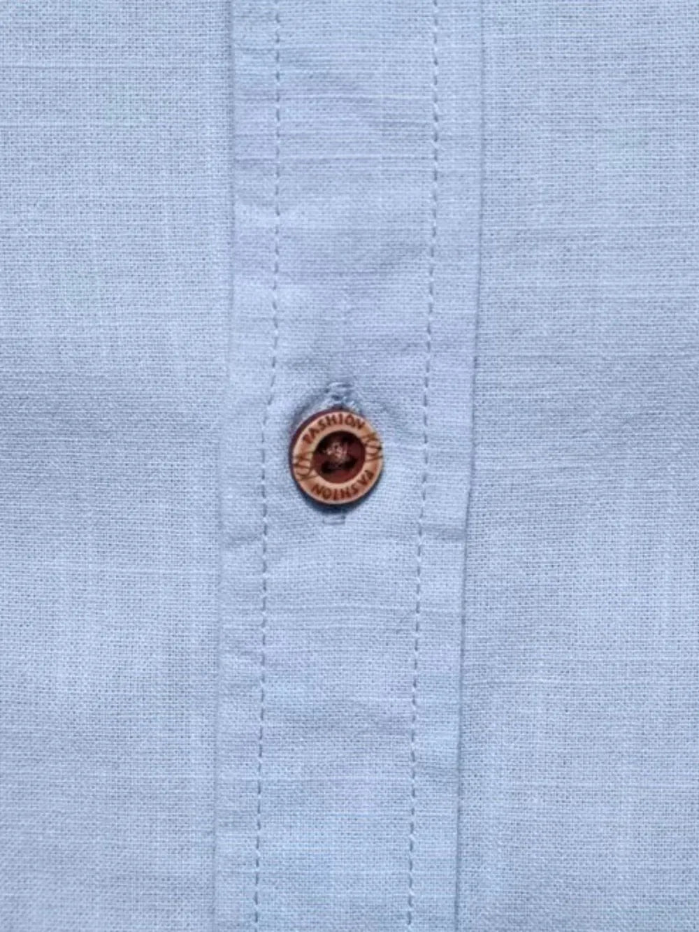 Men's button-down shirt with brown branded button and stitched placket