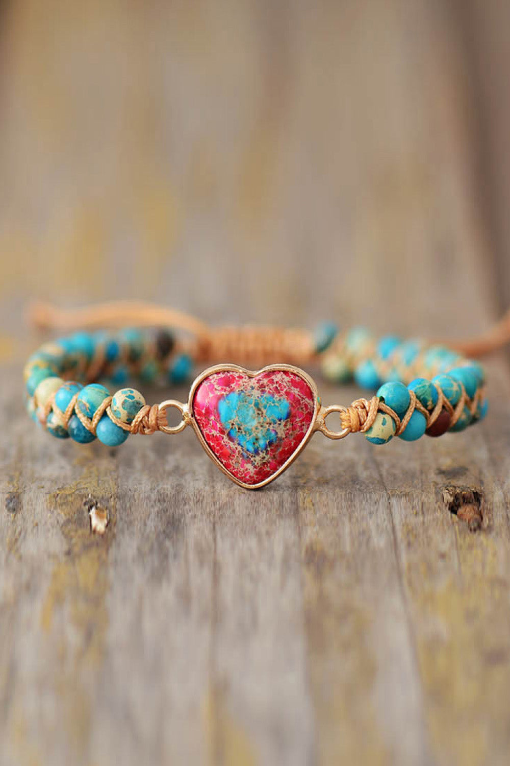 Turquoise braided bracelet with gold clasp and heart-shaped turquoise stone pendant