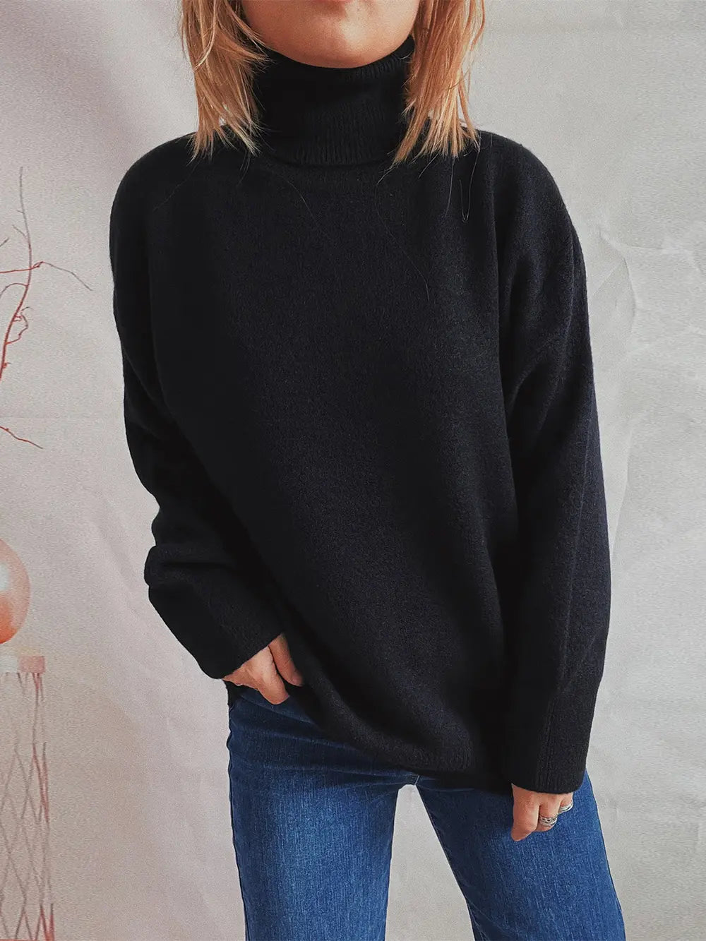 Black turtleneck long sleeve sweater with ribbed collar and cuffs