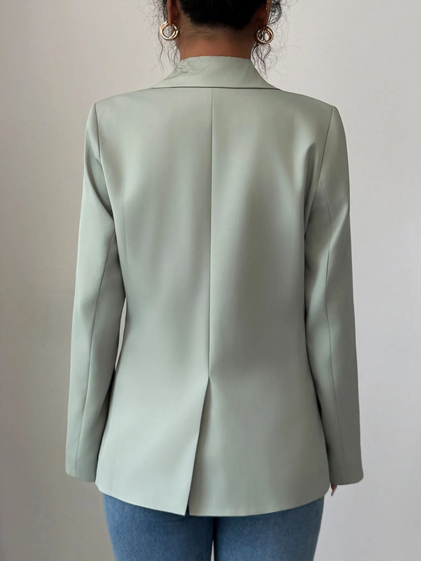 Light green one-button lapel blazer back view with central seam