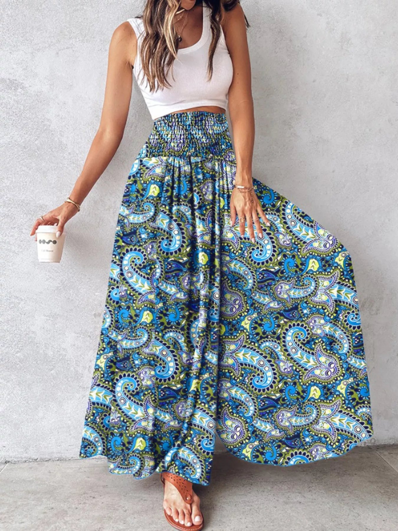 Printed wide-leg pants with teal and blue paisley pattern, elastic waist, maxi length.
