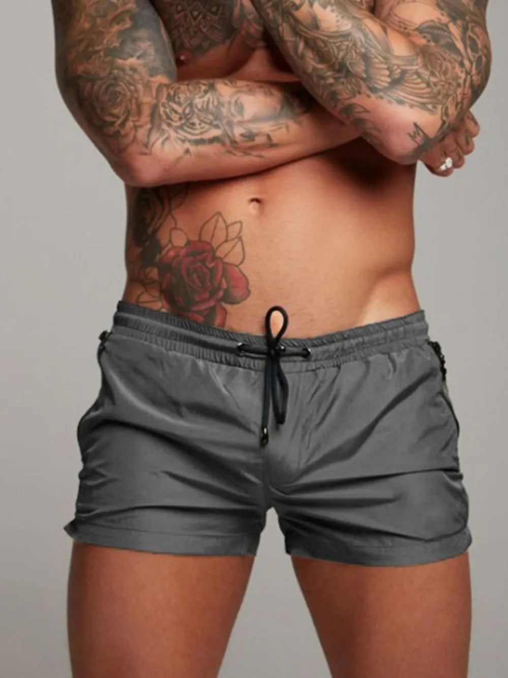Men's active shorts in dark gray with elastic waistband and drawstring