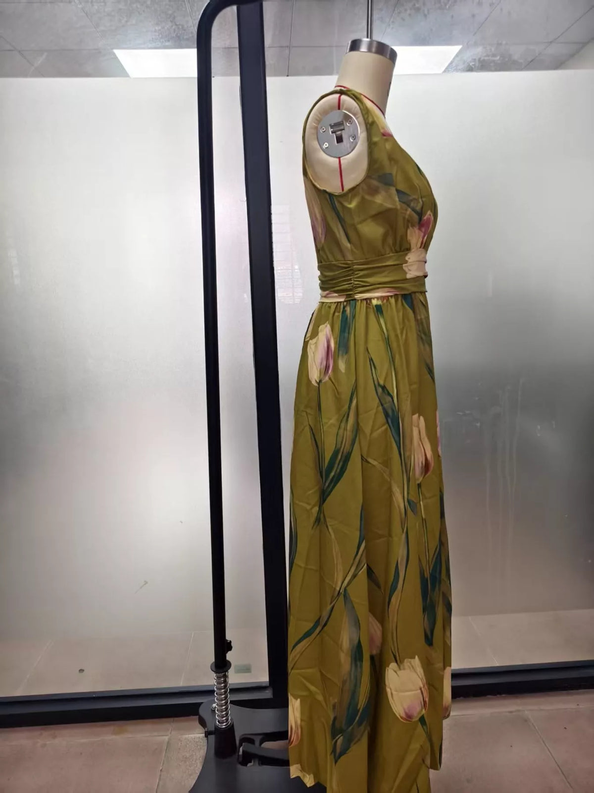Olive green floral maxi dress on hanger, sleeveless V-neck with ruched waist