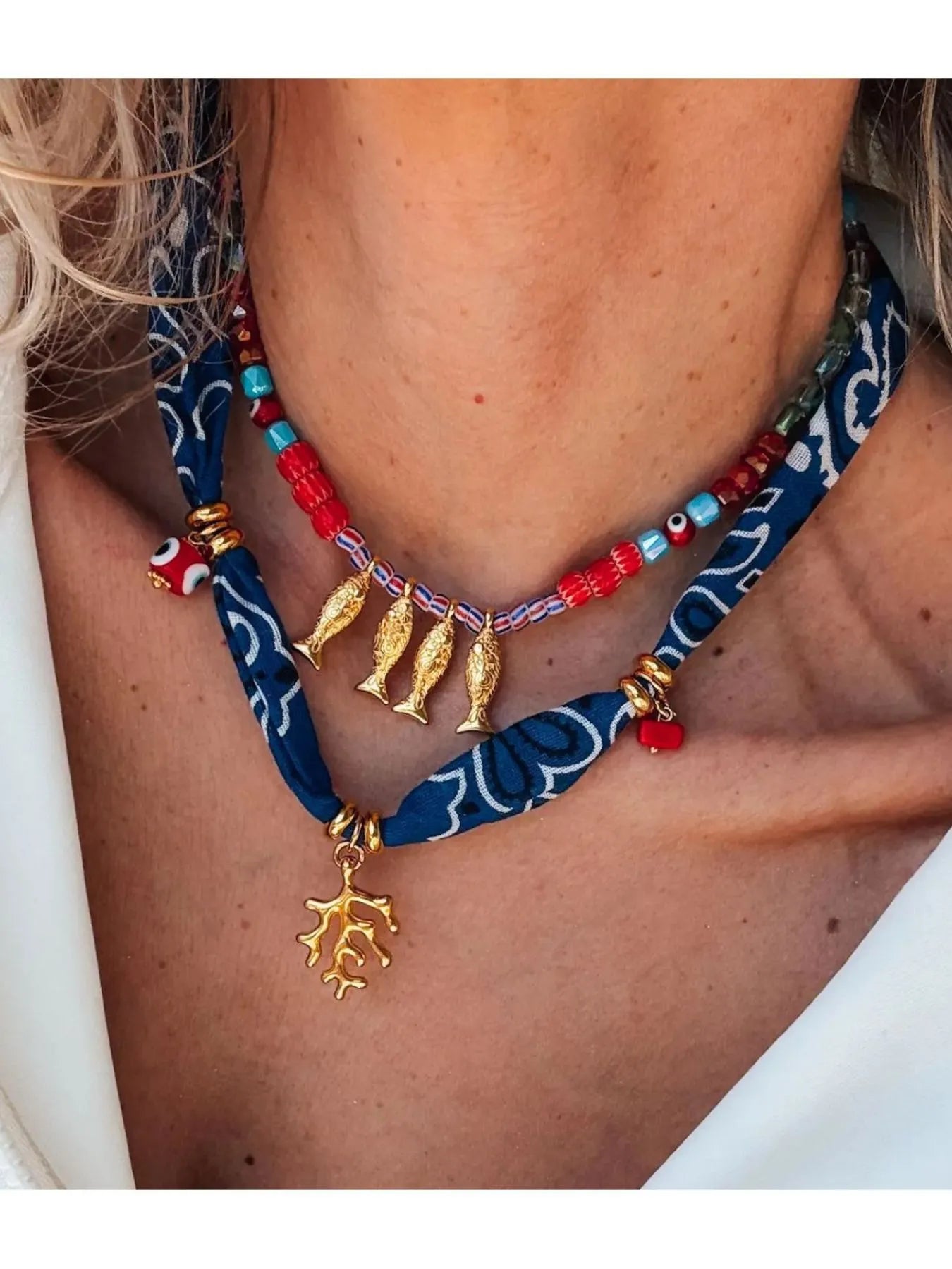 2-piece necklace with gold fish pendant, red and teal bead details