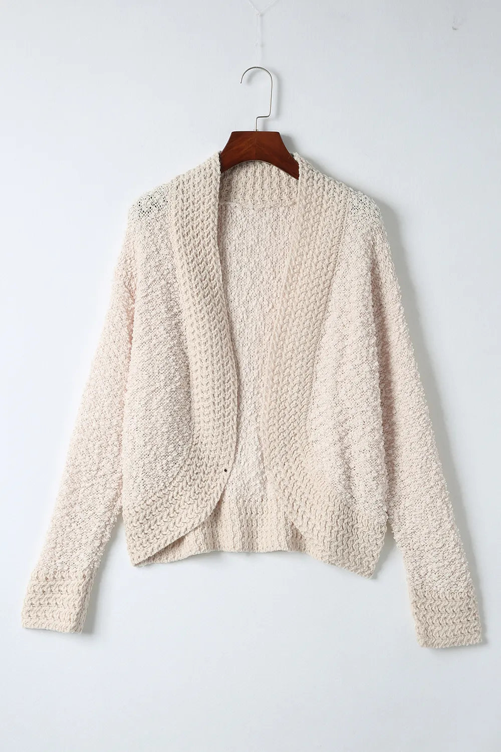 Cream open-front cardigan with open center front and textured knit design