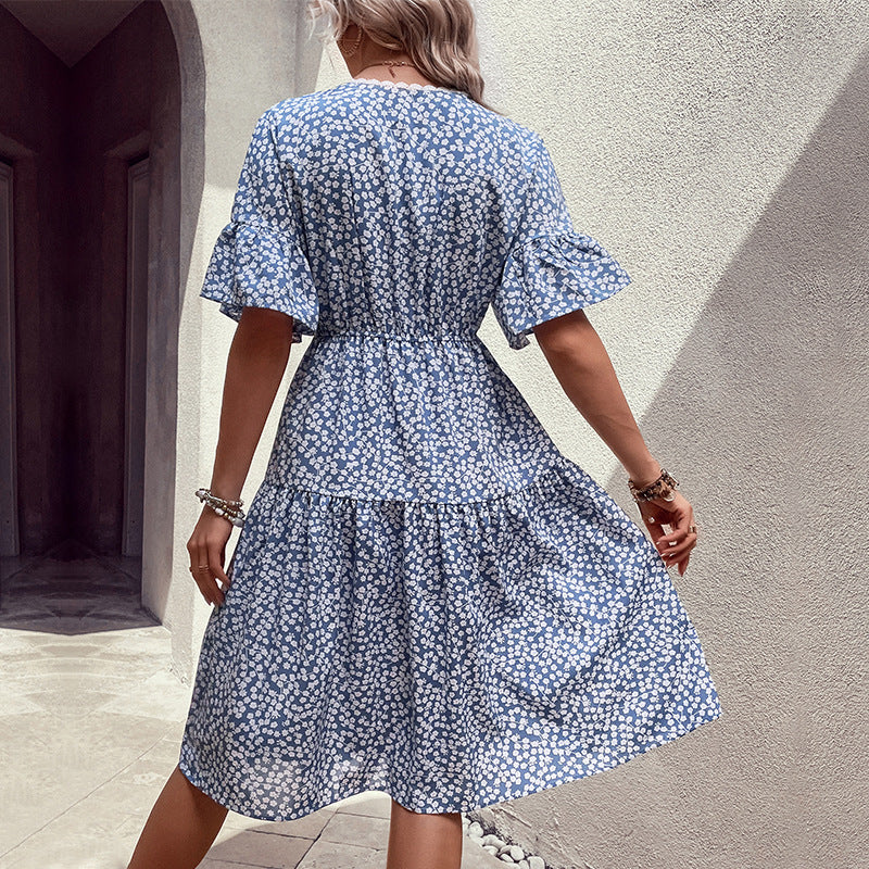 Light blue floral v-neck dress, back view with flounce sleeves and waist tie