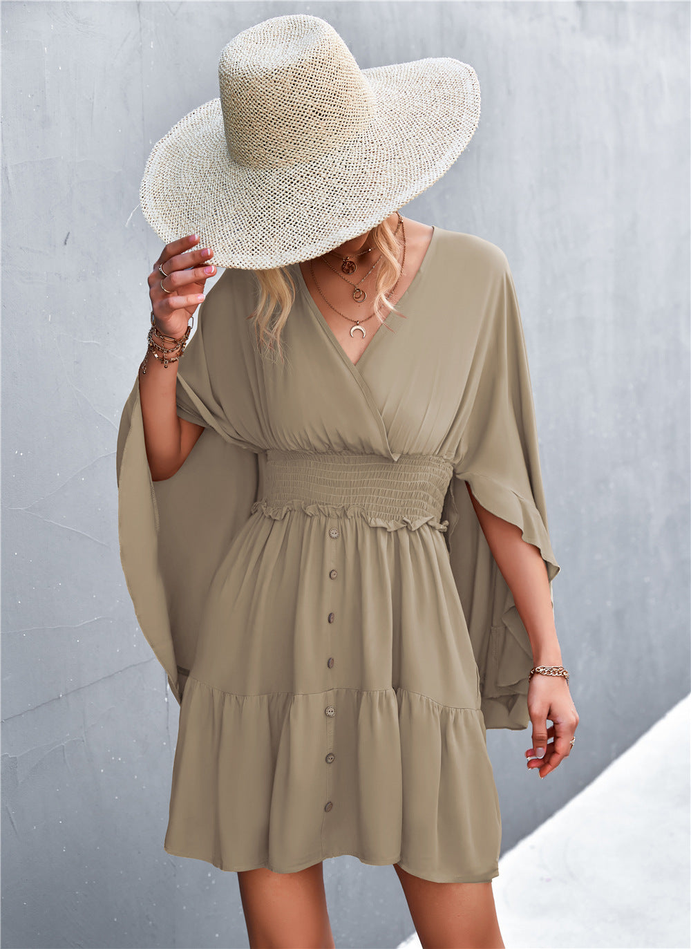 Taupe surplice dress with smocked waist and button-front, tiered skirt