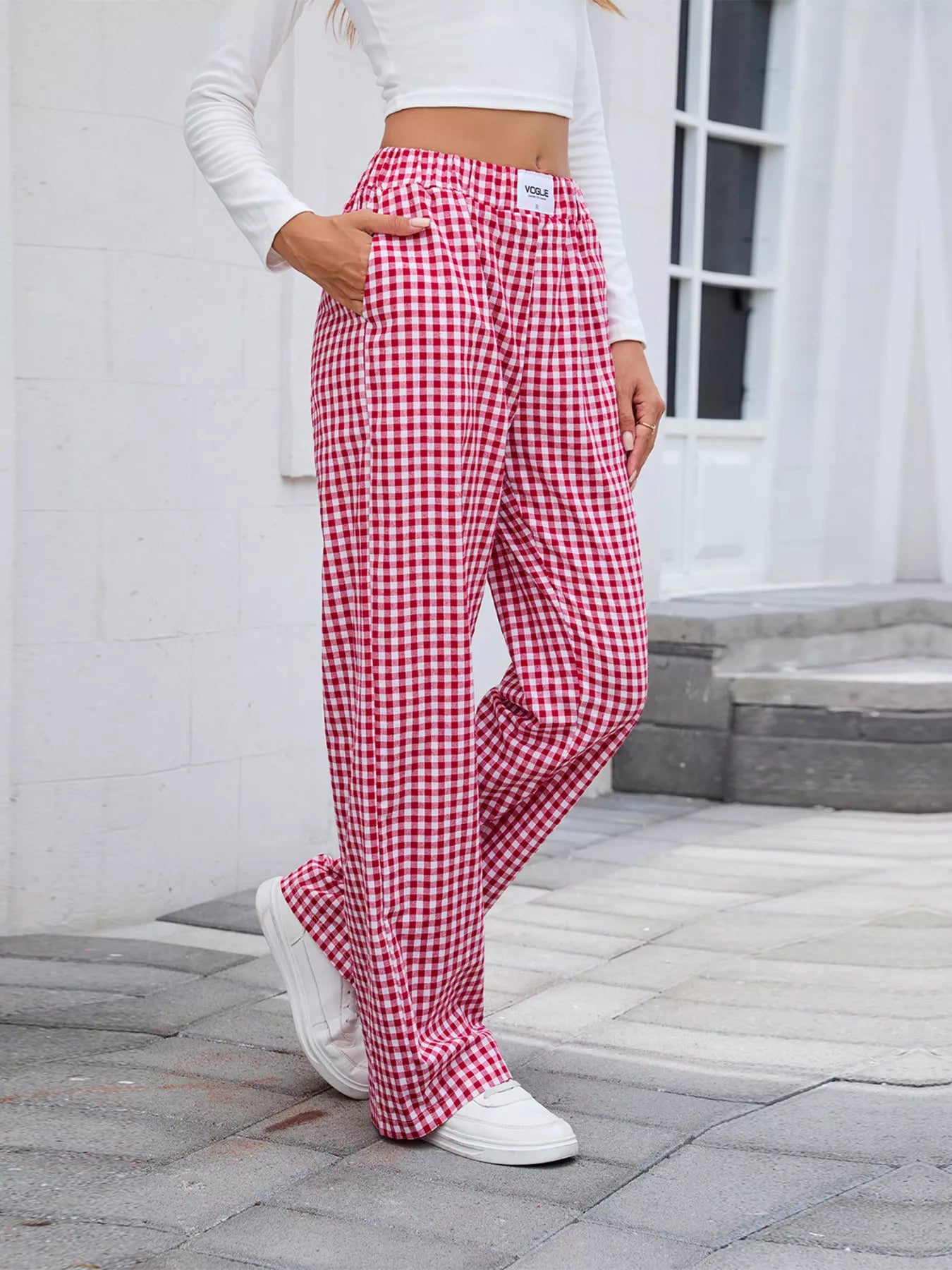 Plaid wide-leg casual pants in red and white with elastic waistband and drapey legs.