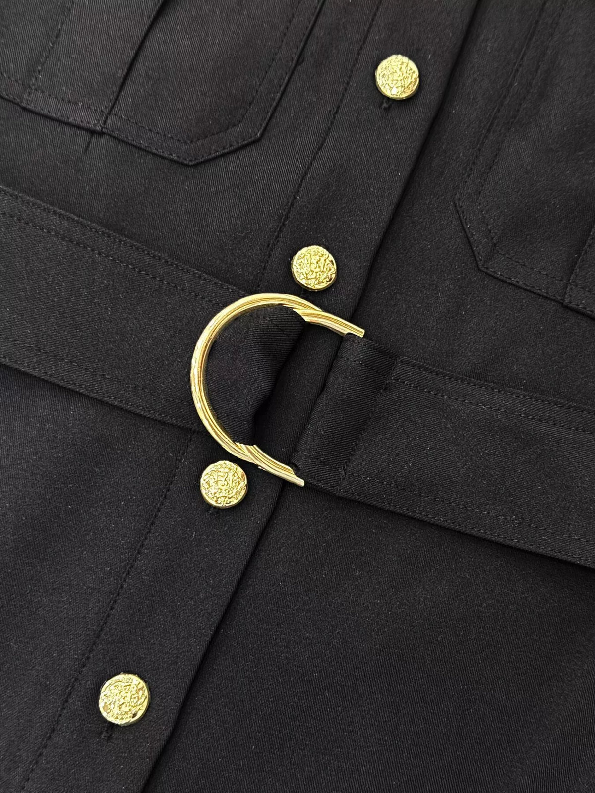 Black belted midi dress detail: gold buckle and gold button front