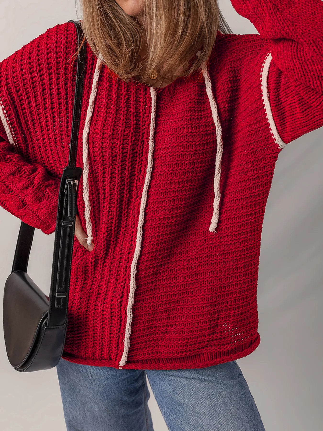 Deep red textured knit hooded sweater with white trim and hanging drawstring cords