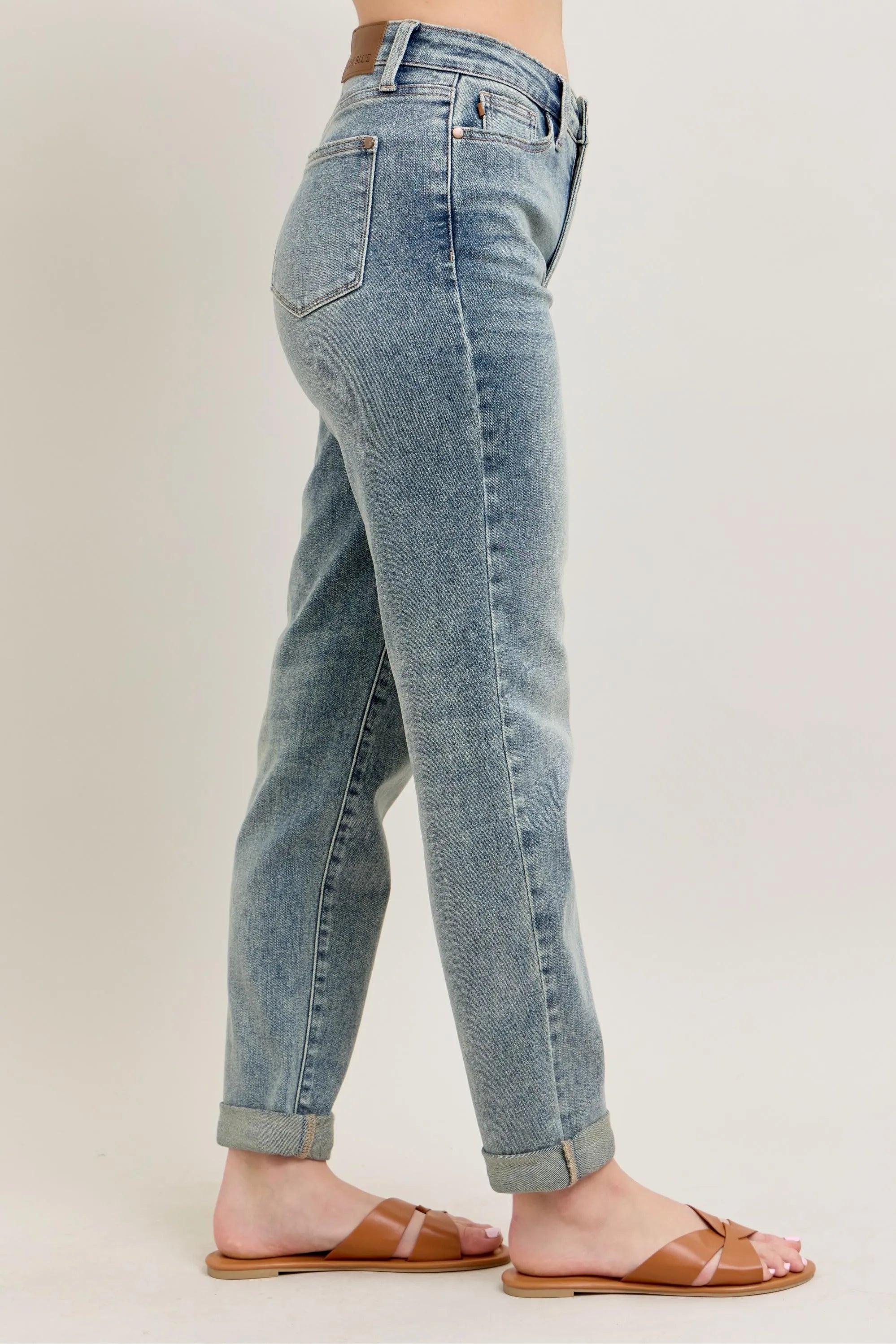Light blue vintage-wash jeans back-side view with double roll cuff hem