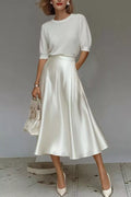 White satin A-line midi skirt with side pockets, smooth drape and mid-calf length