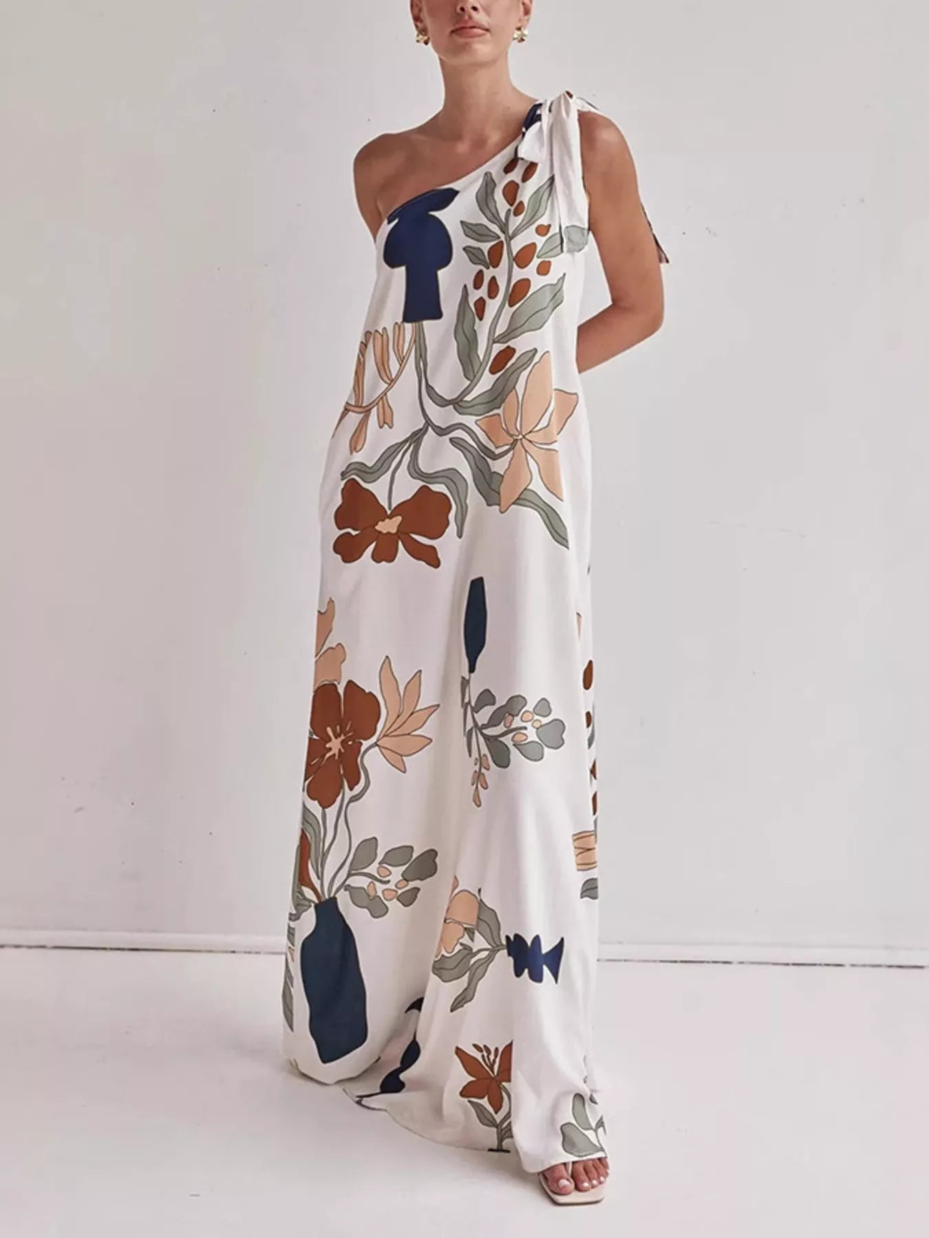 Cedar & Moore Bohemian Floral Print One-Shoulder Maxi Dress by Trendsi, white with bold botanical print.