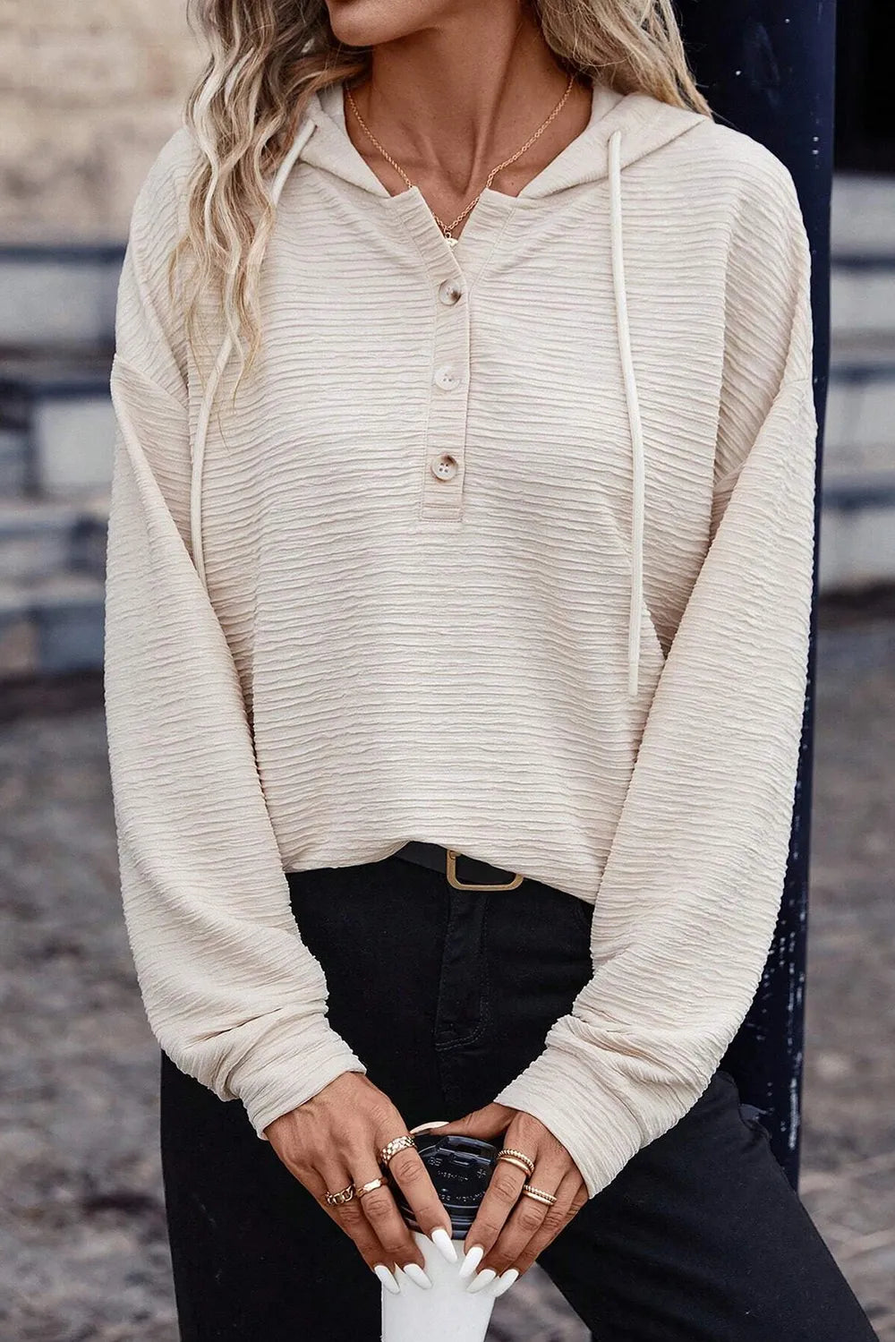 Ivory drawstring hoodie with half-button front and dropped-shoulder long sleeves