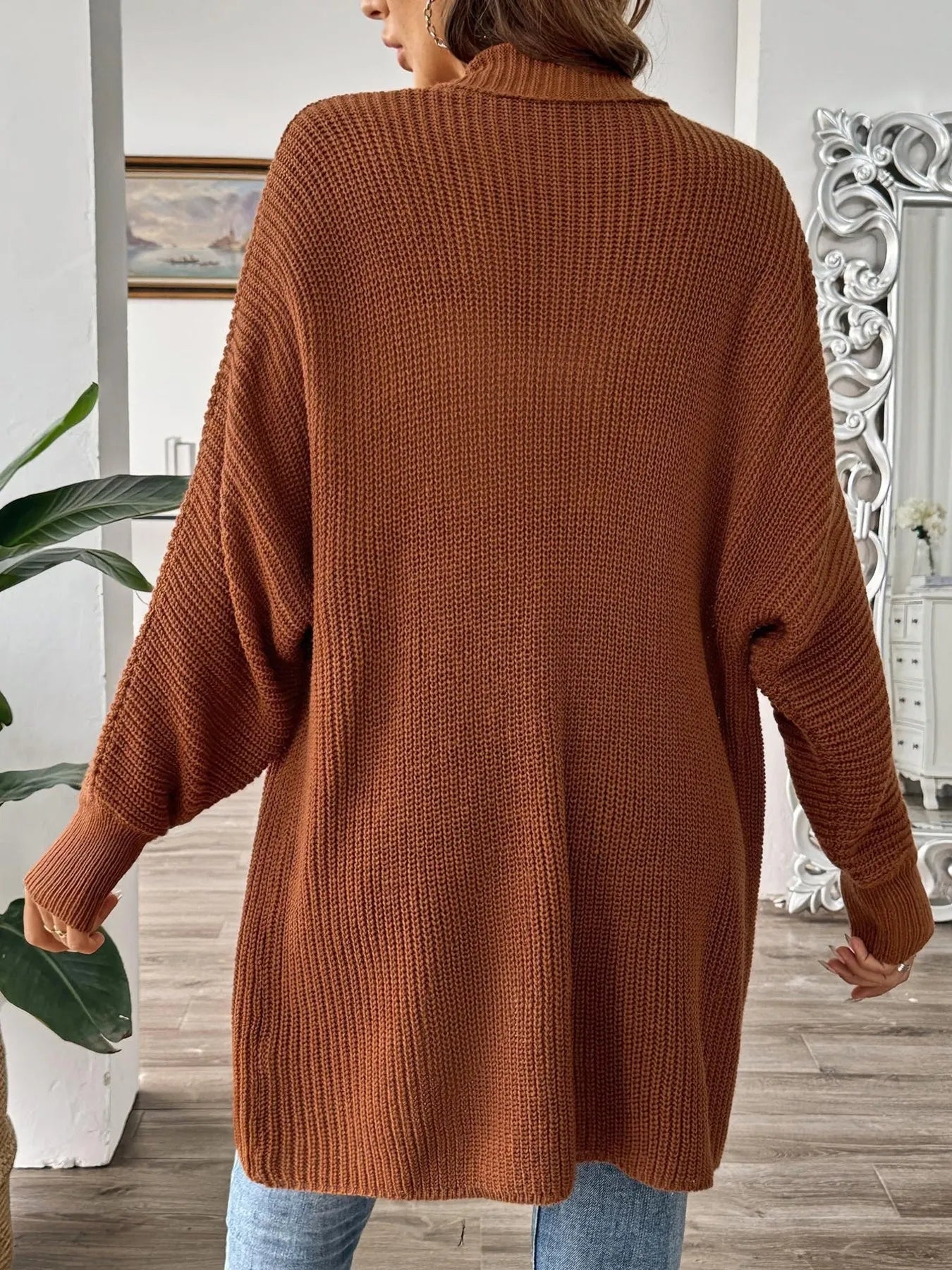Brown oversized knit cardigan, open front style, back view, long sleeves, hip length