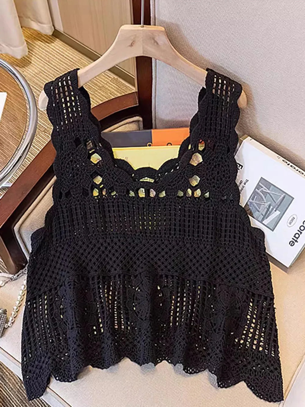 Black crochet scoop neck tank with scalloped hem and small gold-toned accents