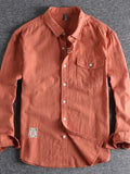 Men's button-down long sleeve shirt, orange with chest pocket and button front