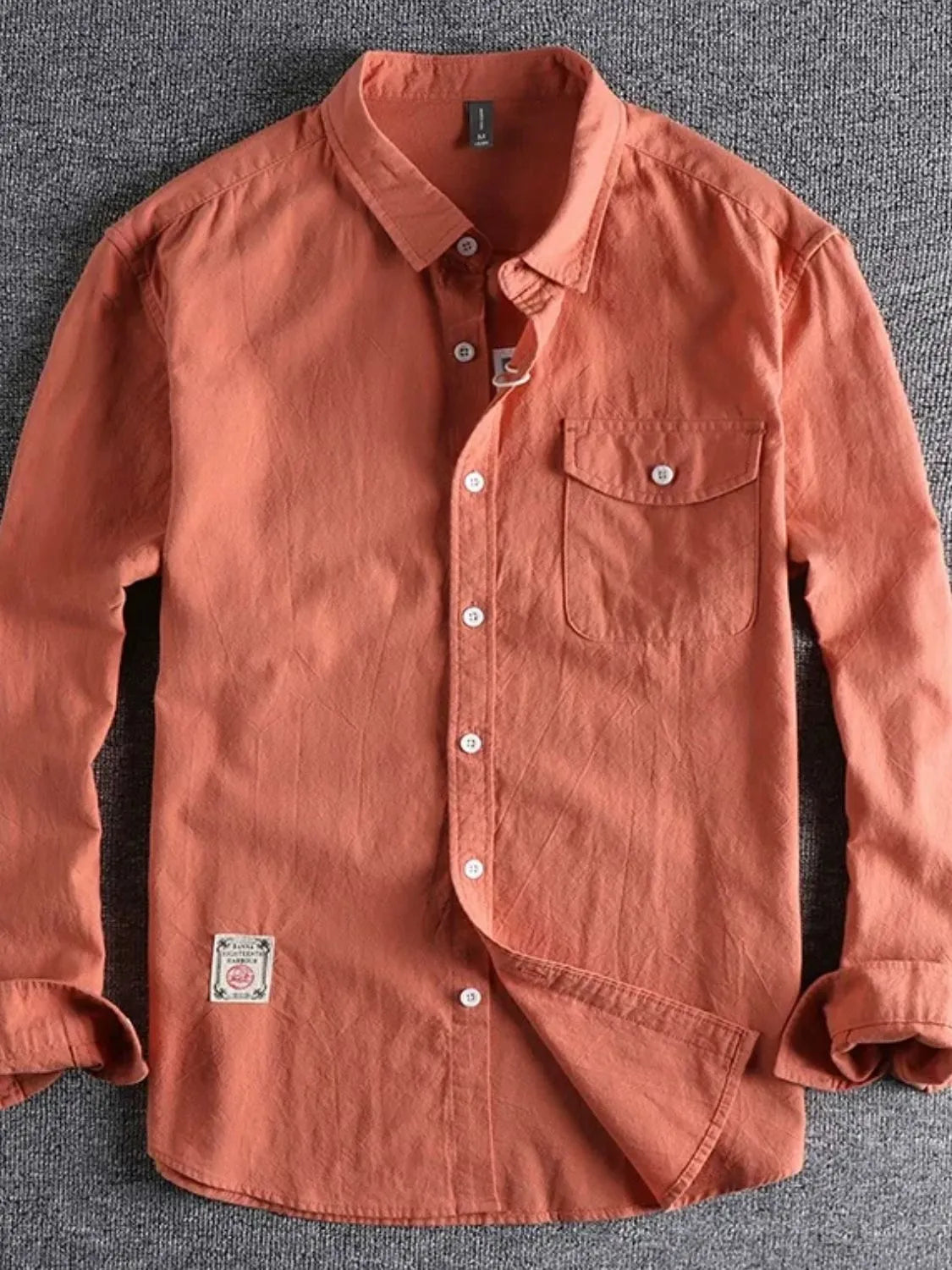 Men's button-down long sleeve shirt, orange with chest pocket and button front
