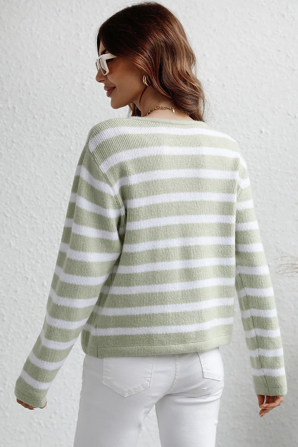 Light green striped cardigan, back view with long sleeves and button placket