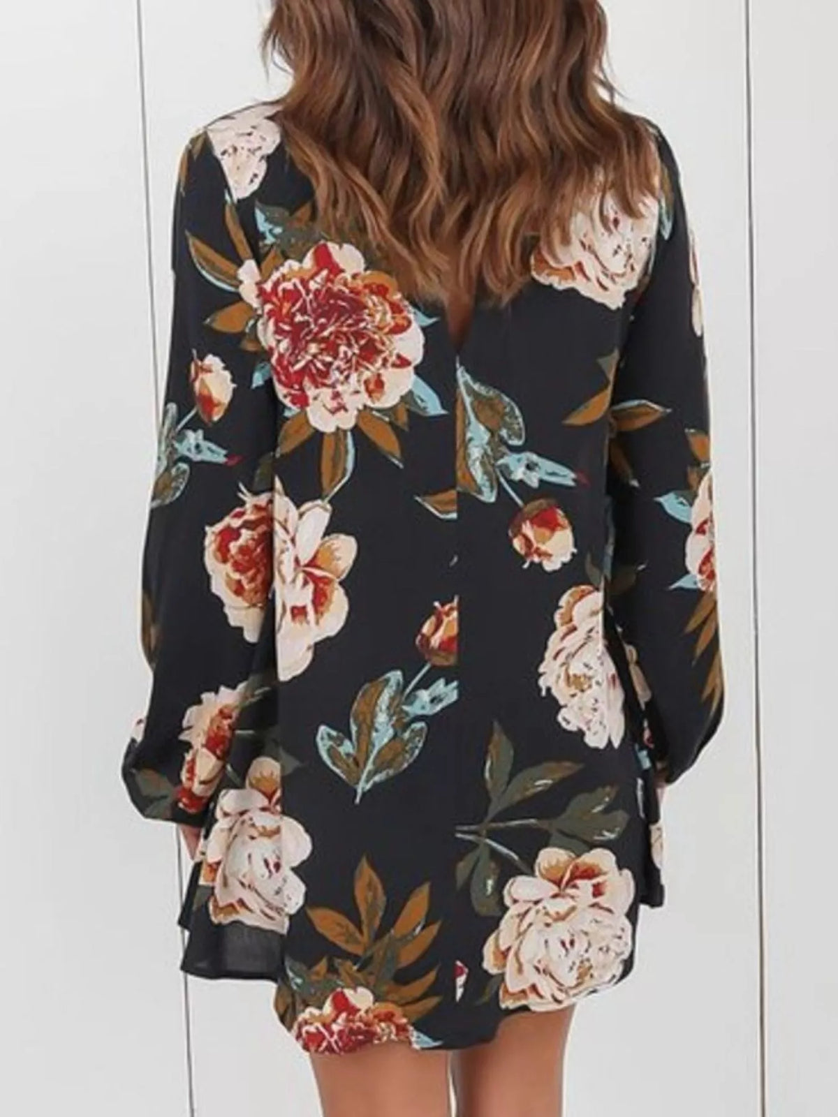 Black floral choker-neck long-sleeve blouse, back view with flower print