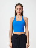 Royal blue scoop neck active tank with racerback, cropped fit.