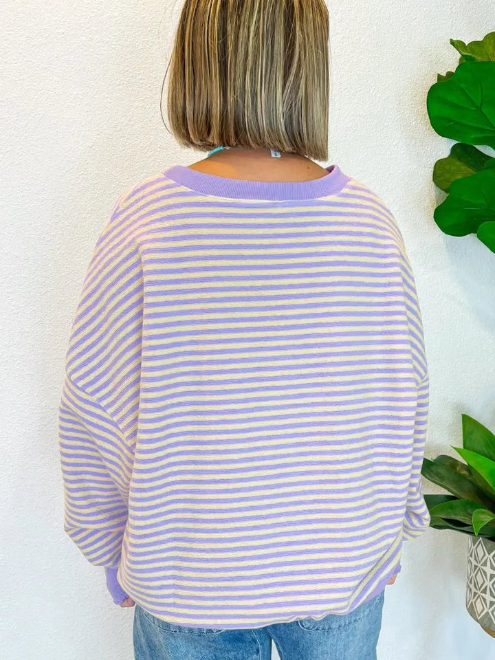Lavender and white striped sweatshirt with round neck, long sleeves, back view