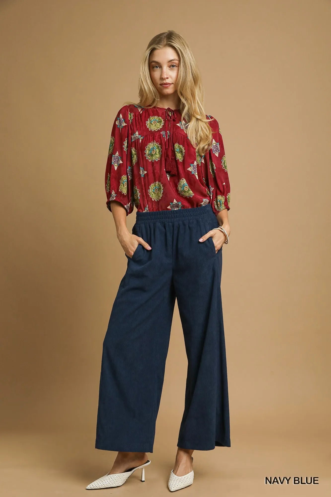 Navy blue corduroy wide-leg pants with elastic waistband and ankle-length hems