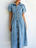 Blue denim midi dress with puff sleeves and button front, pleated waist