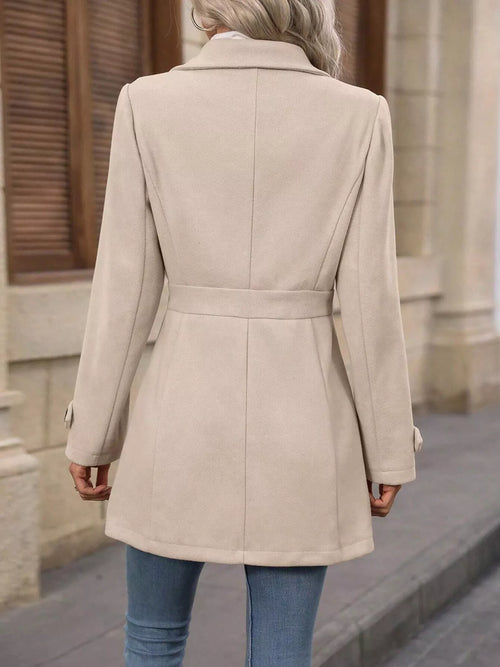 Women’s light beige double-breasted long-sleeve coat, back view with waist belt