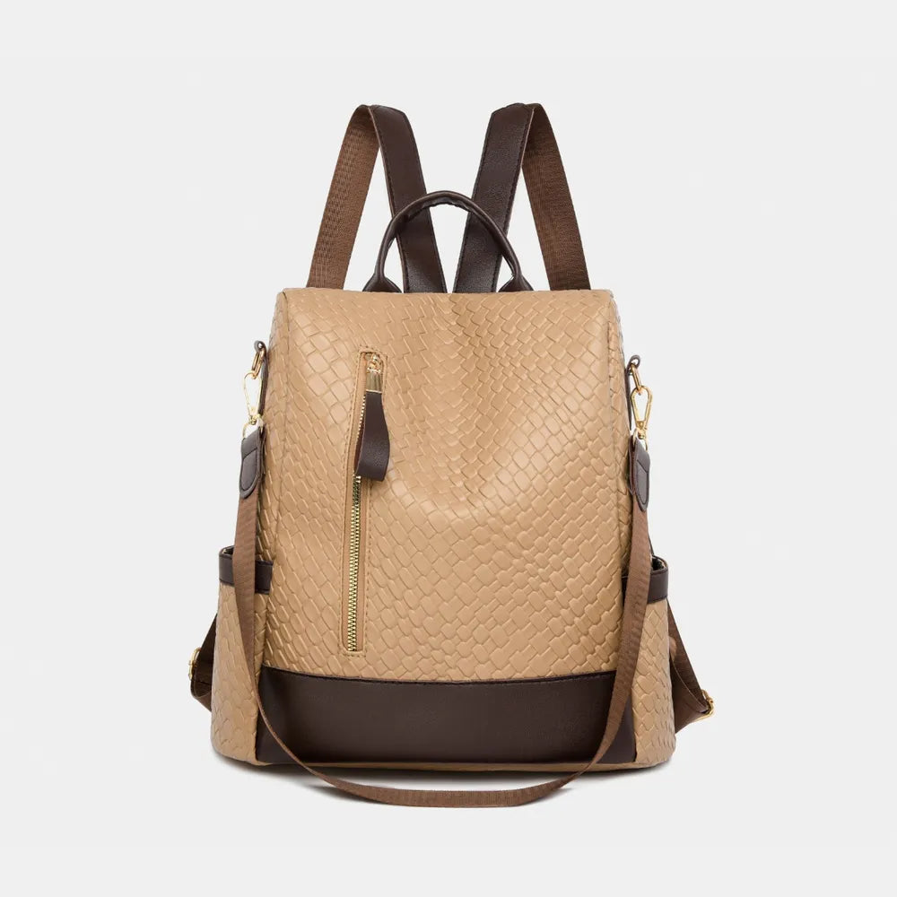 Vegan leather backpack bag in ivory with dark trim, top handle, and front zipper pocket.