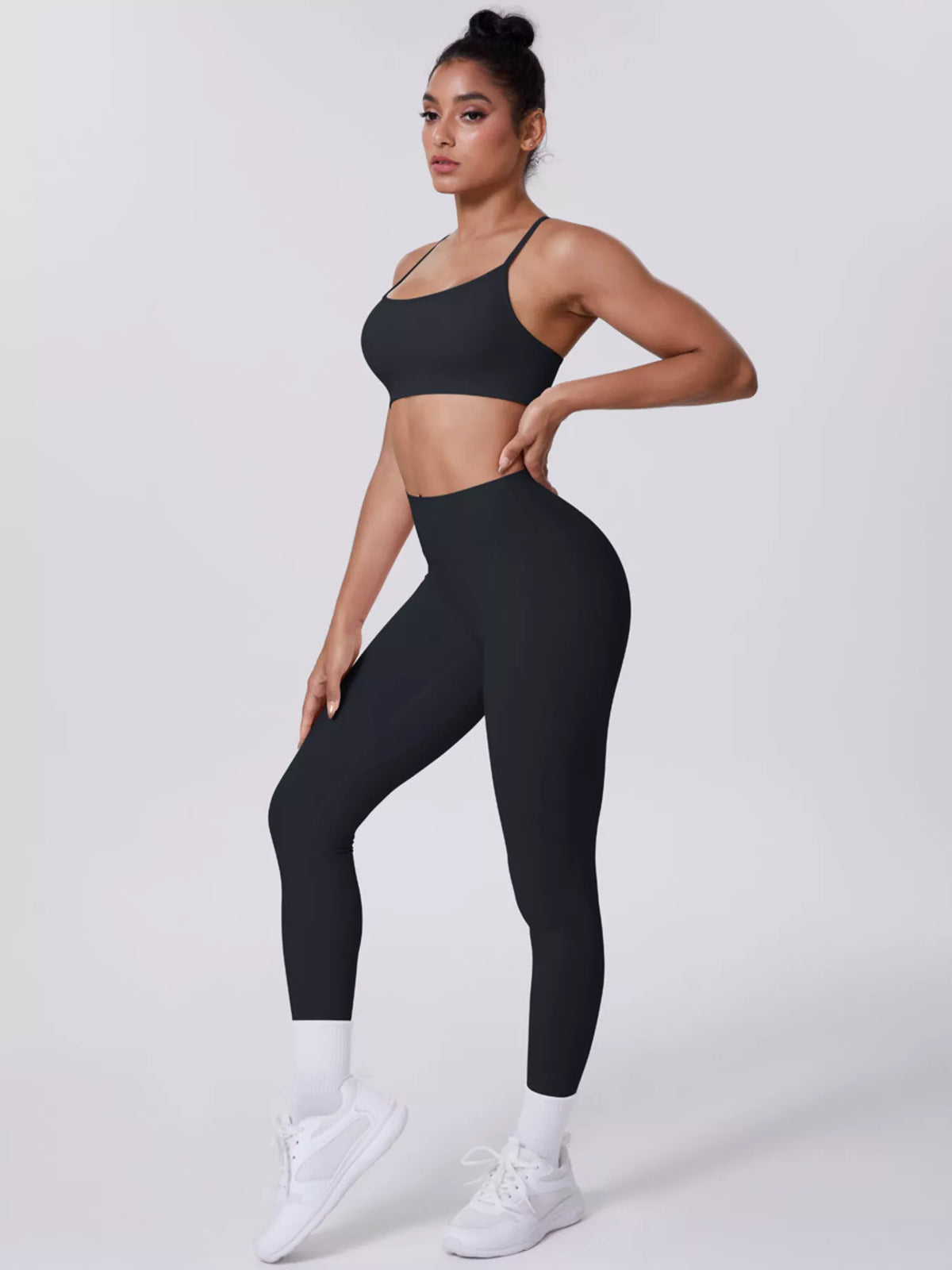 Black seamless criss-cross back cami and high-rise leggings set, sleeveless with leggings