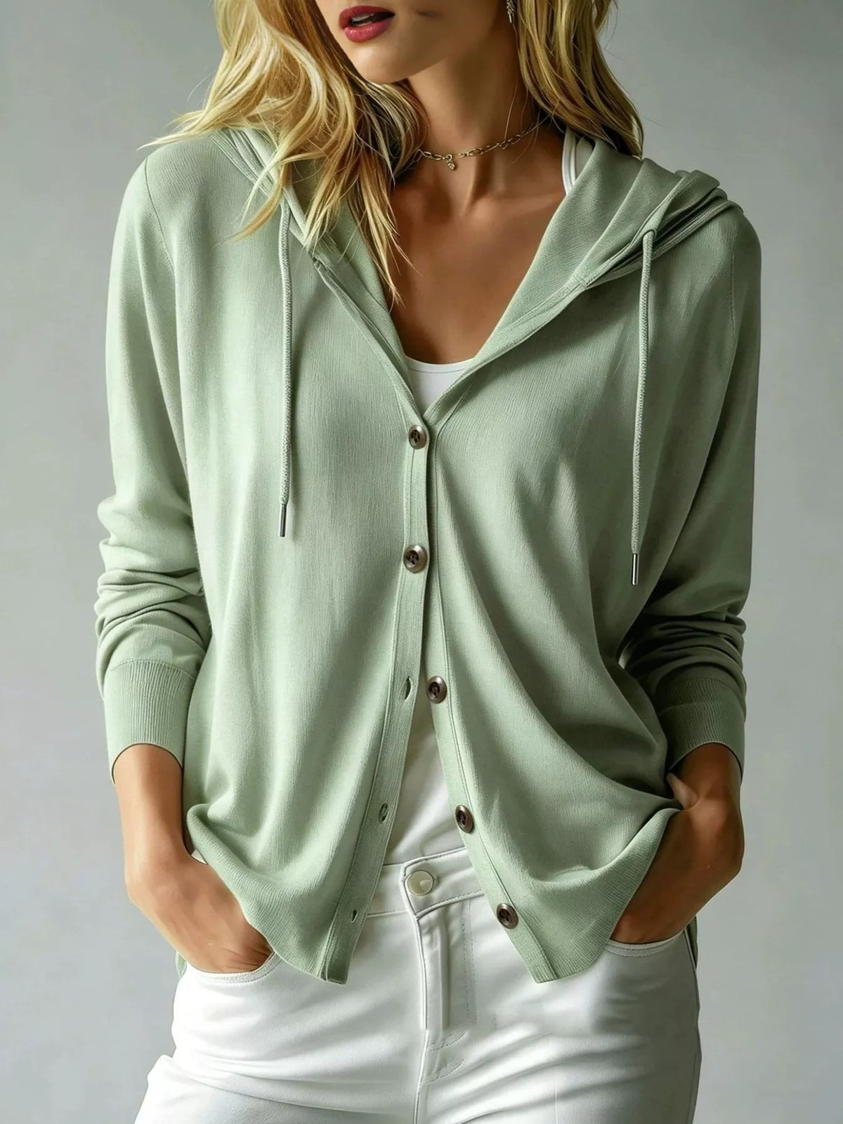 Light green hooded button cardigan with drawstring, front pockets, and long sleeves