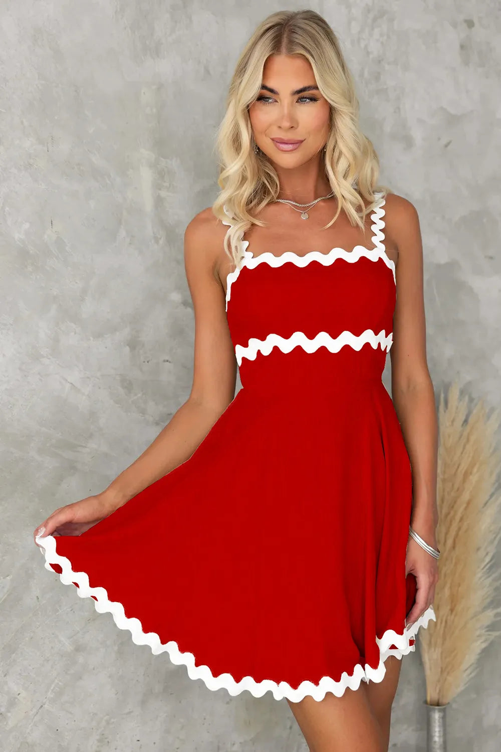 Red square-neck mini dress with white contrast trim at neckline, waist, and hem