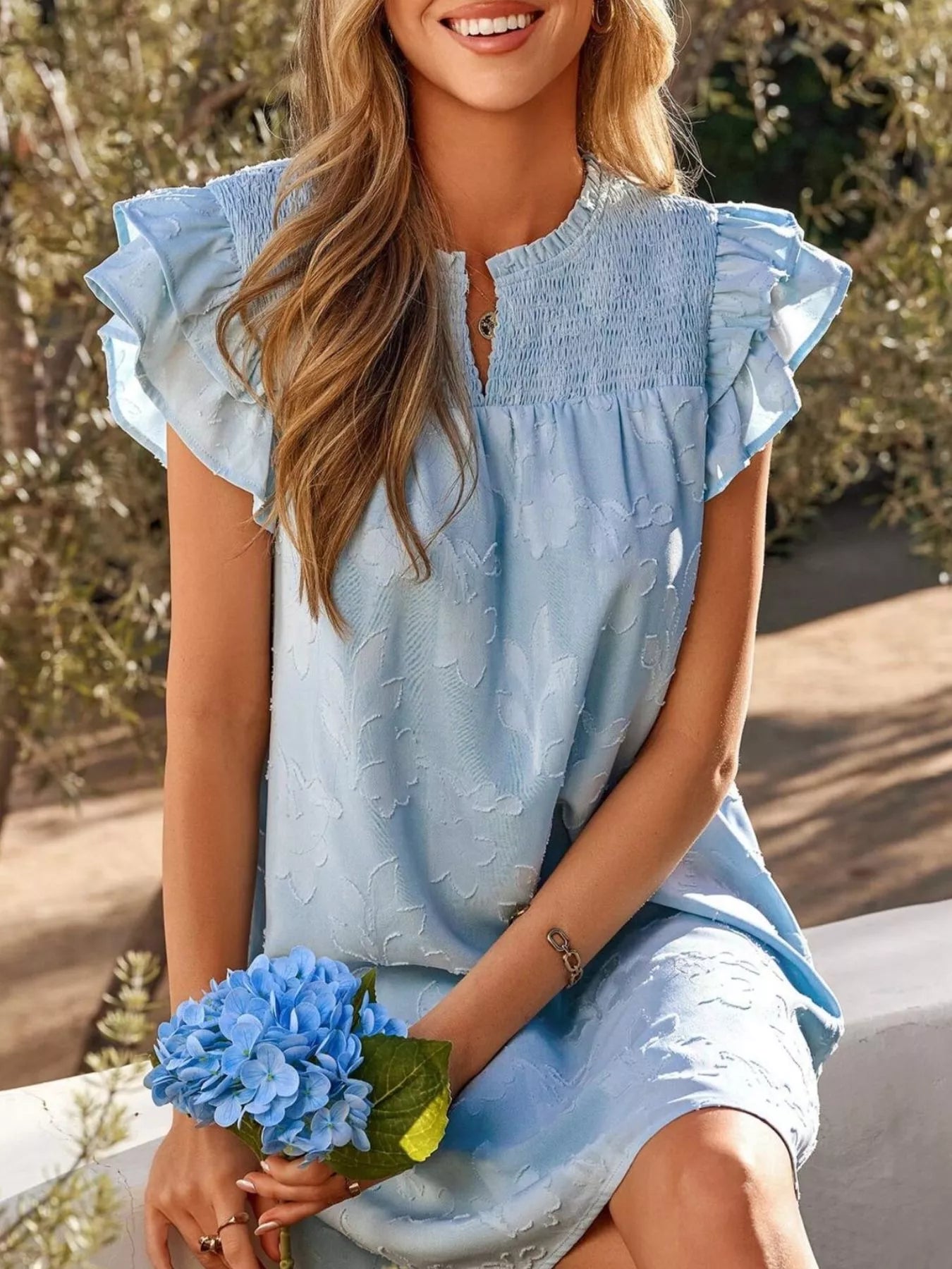Floral embossed ruffle-sleeve mini dress in light blue with smocked bodice.