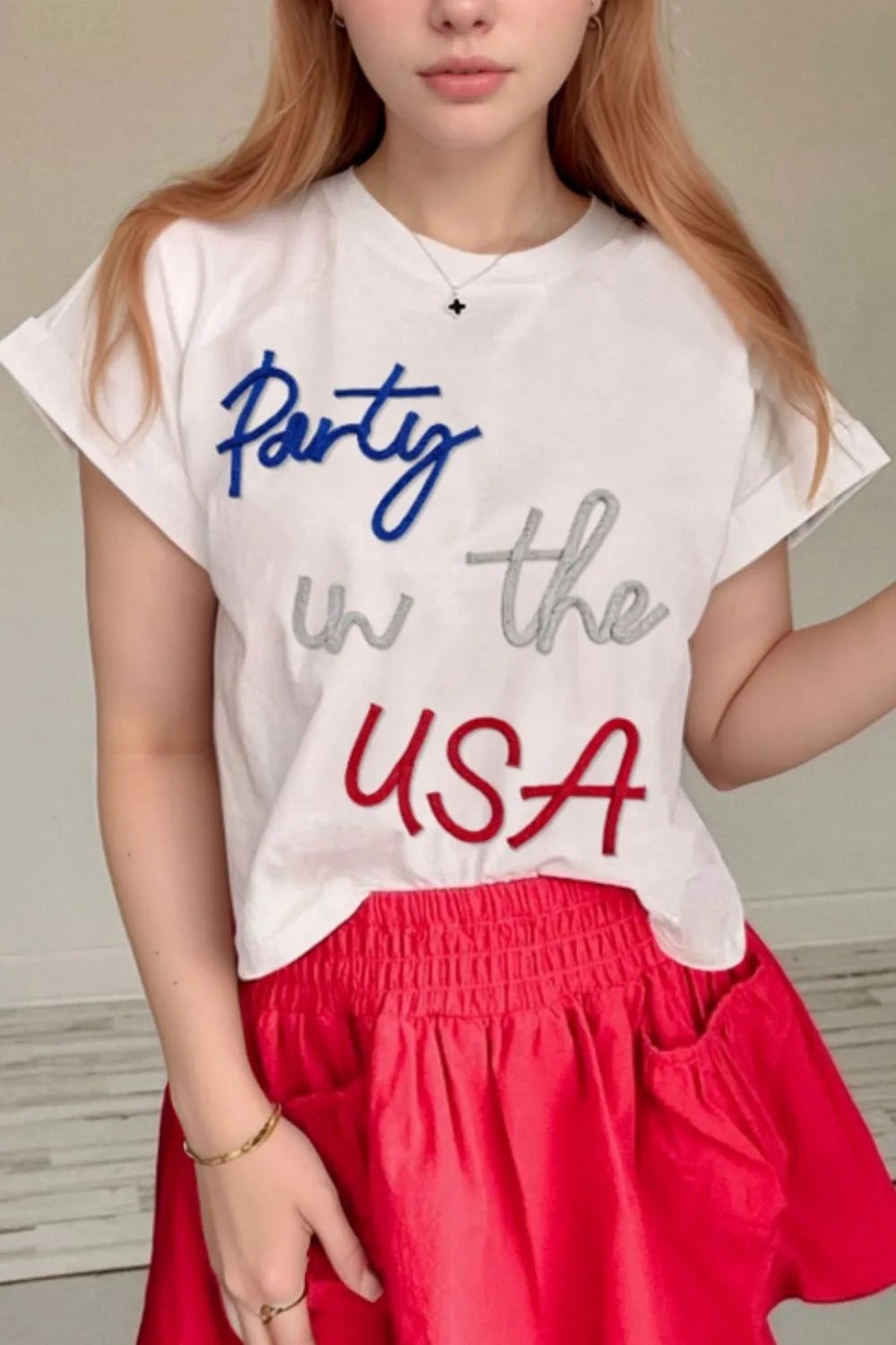 White round-neck short-sleeve T-shirt with 'Party in the USA' graphic
