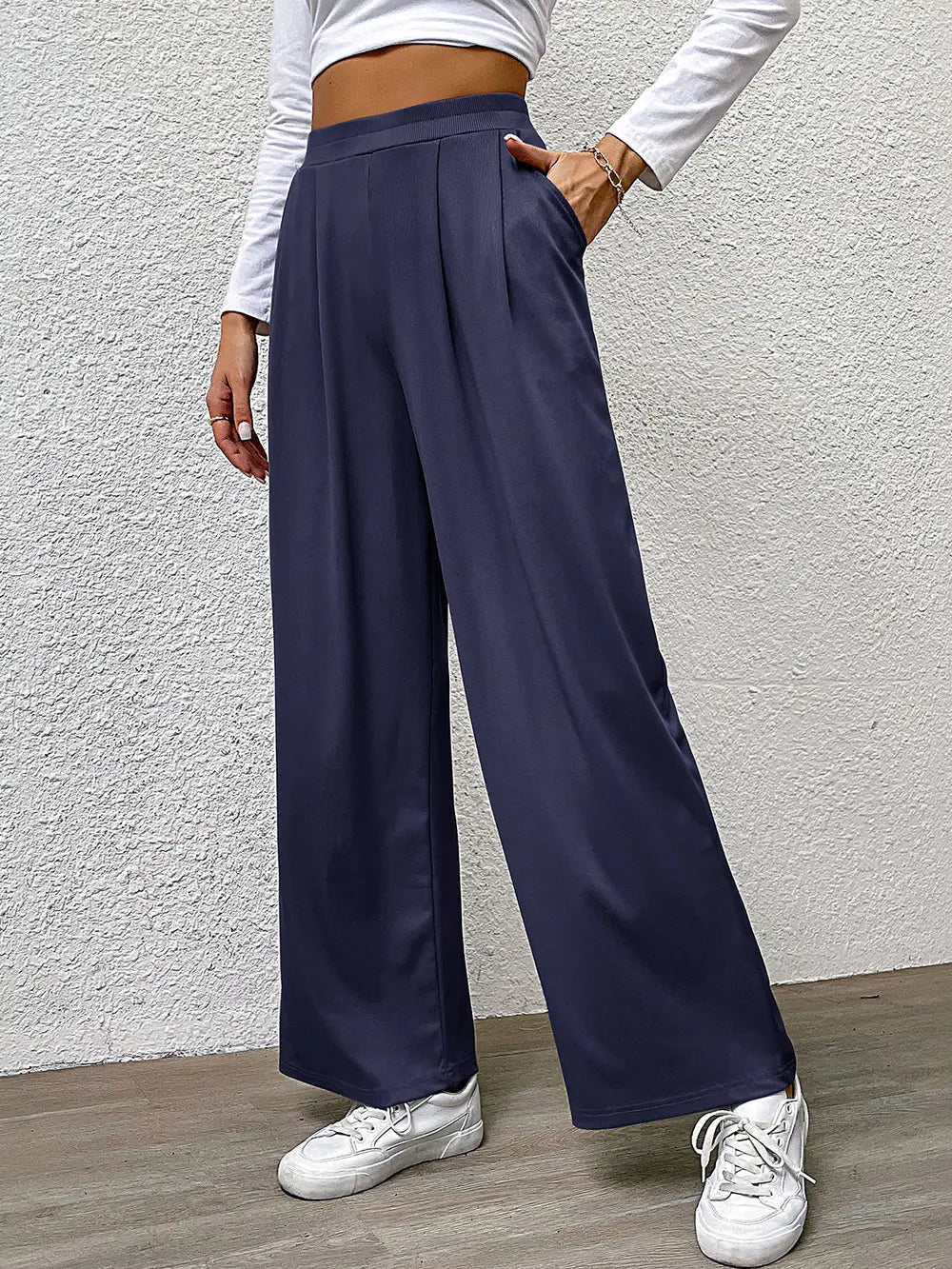 High-waist straight navy pants with wide-leg cut and pleated waist
