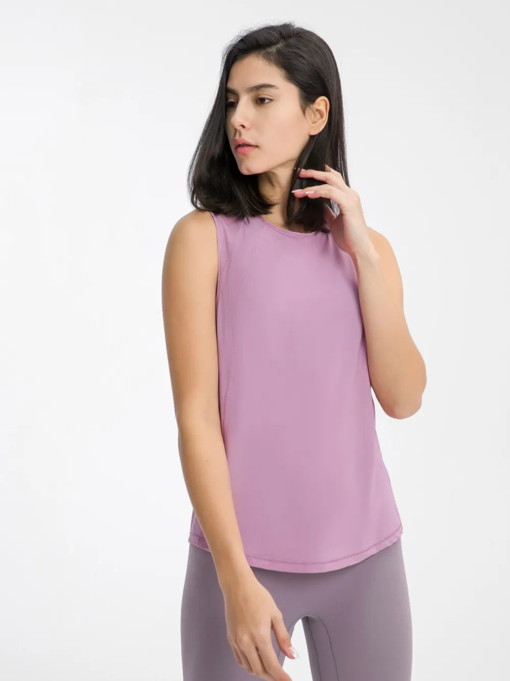 Purple active tank top with sleeveless crew neck and curved hem