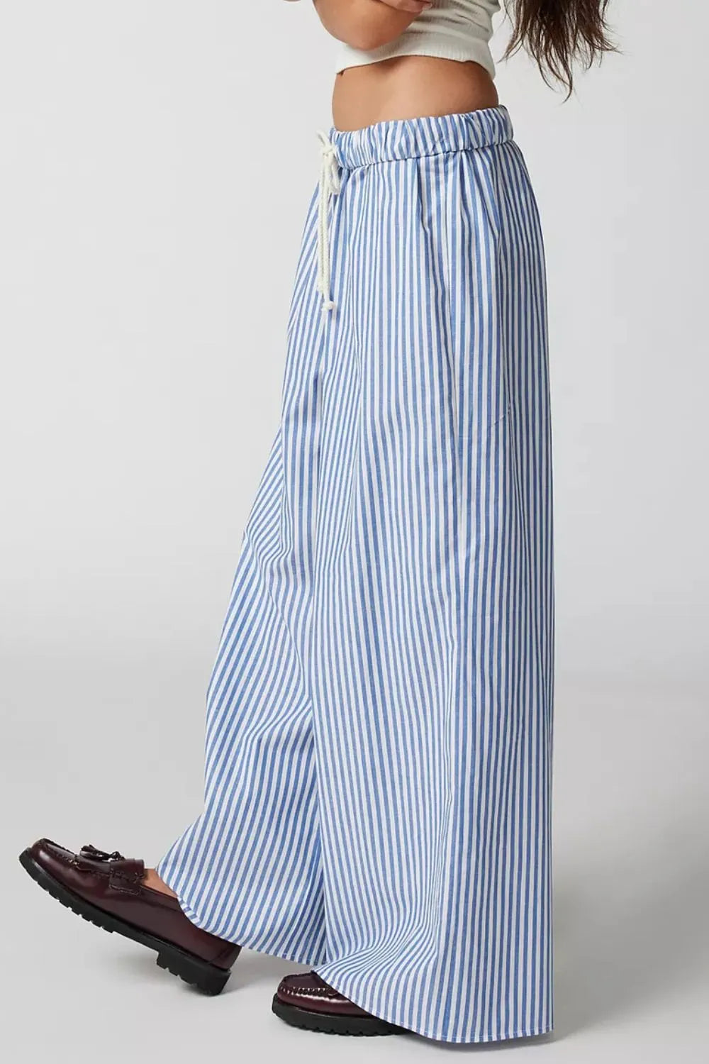 Light blue striped wide-leg pants with drawstring waist and wide hems