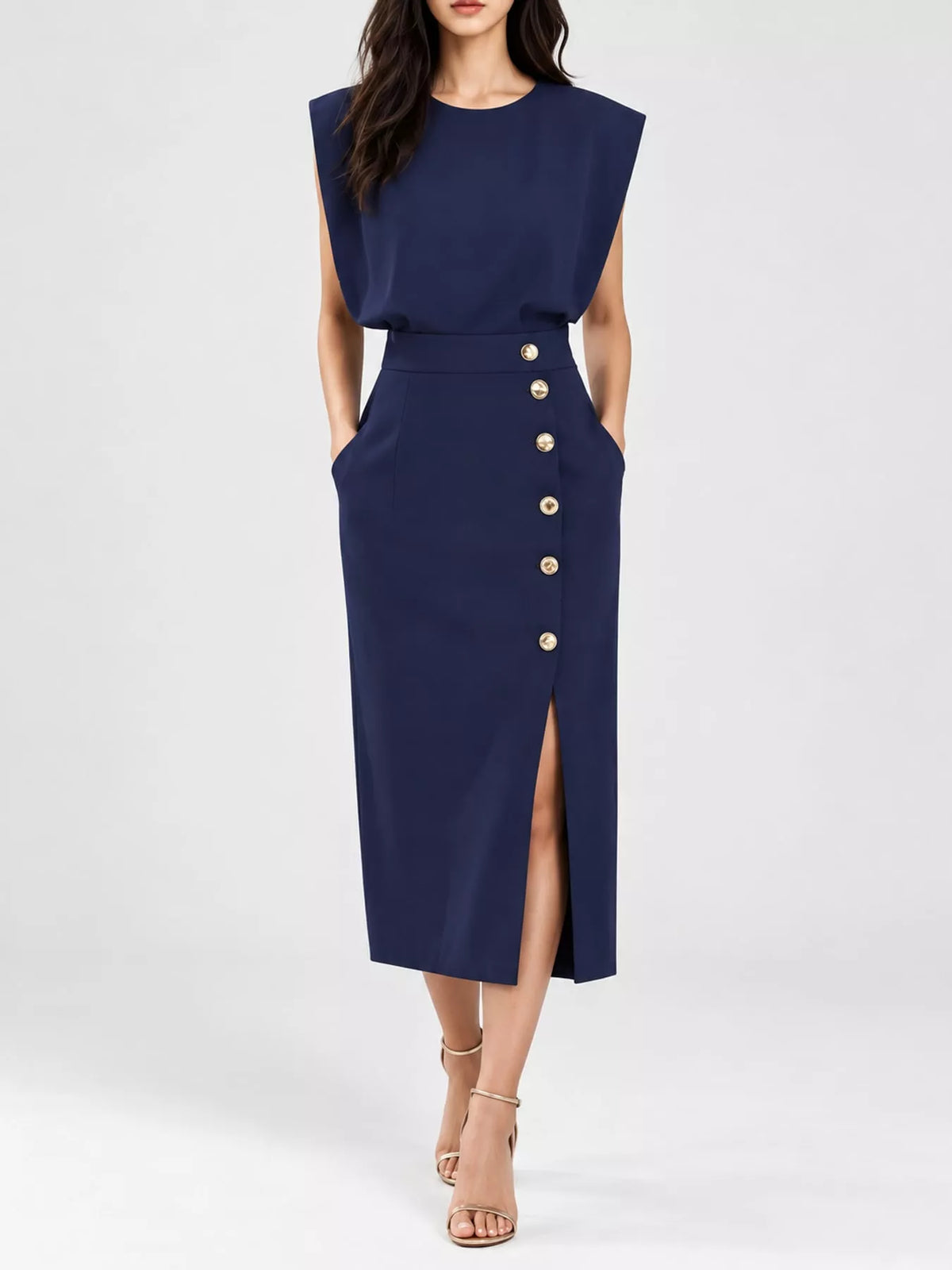 Navy sleeveless midi dress with round neck, gold buttons, and side slit