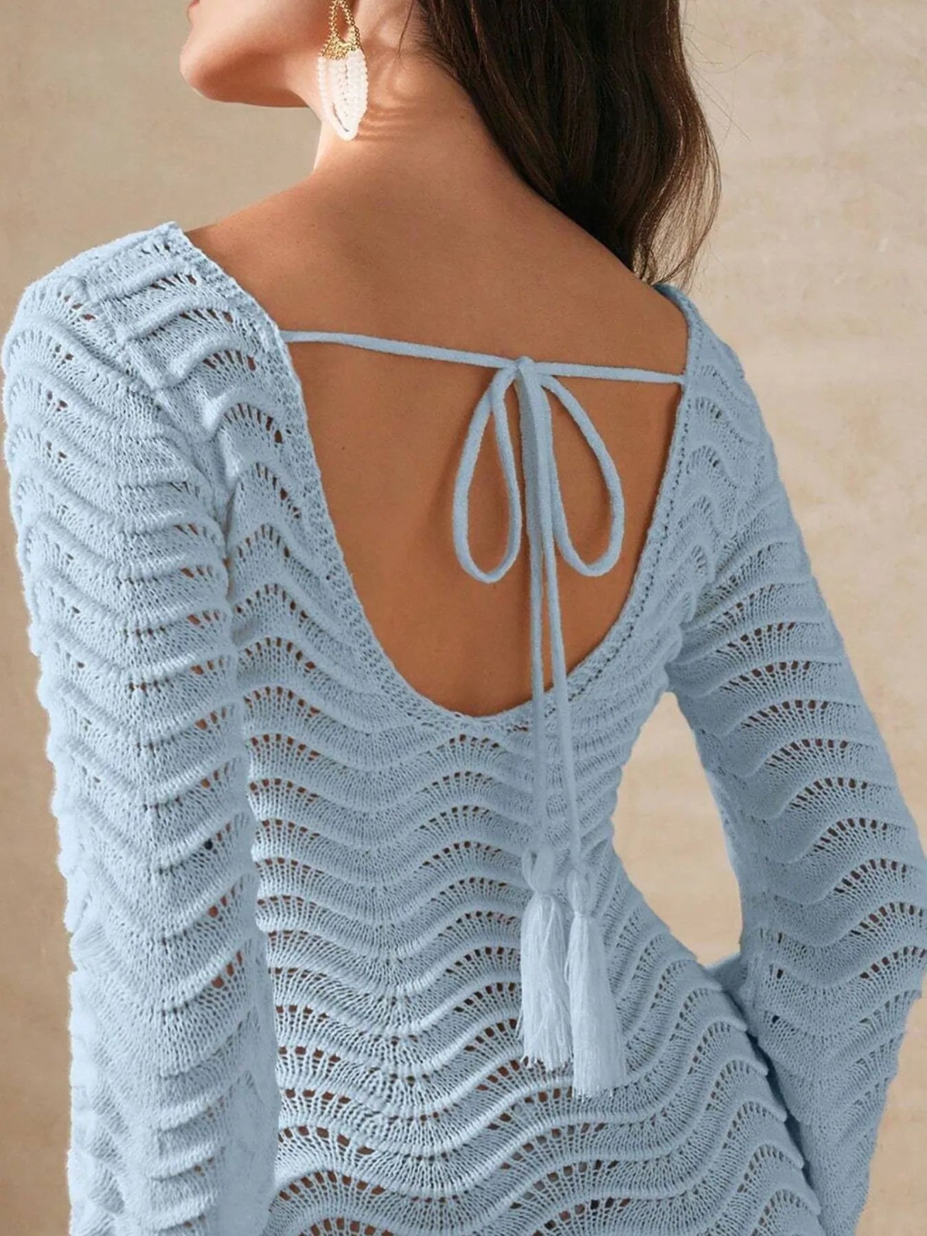 Blue crochet maxi dress detail: open back with lace-up tie and long sleeves