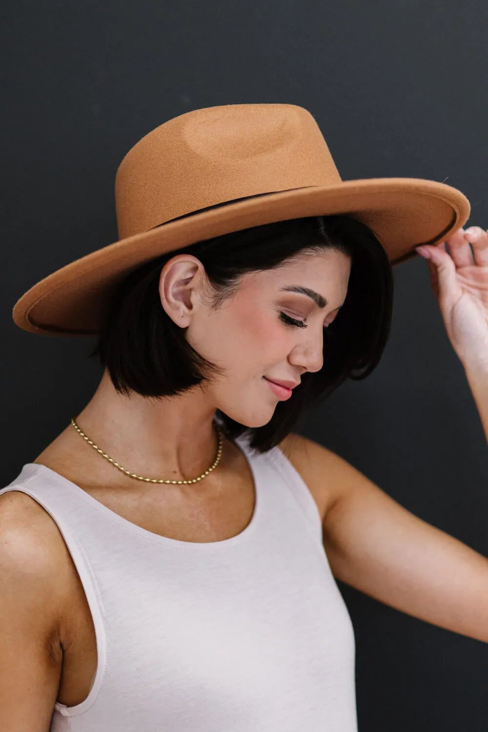 Khaki fedora hat with black ribbon band, wide brim
